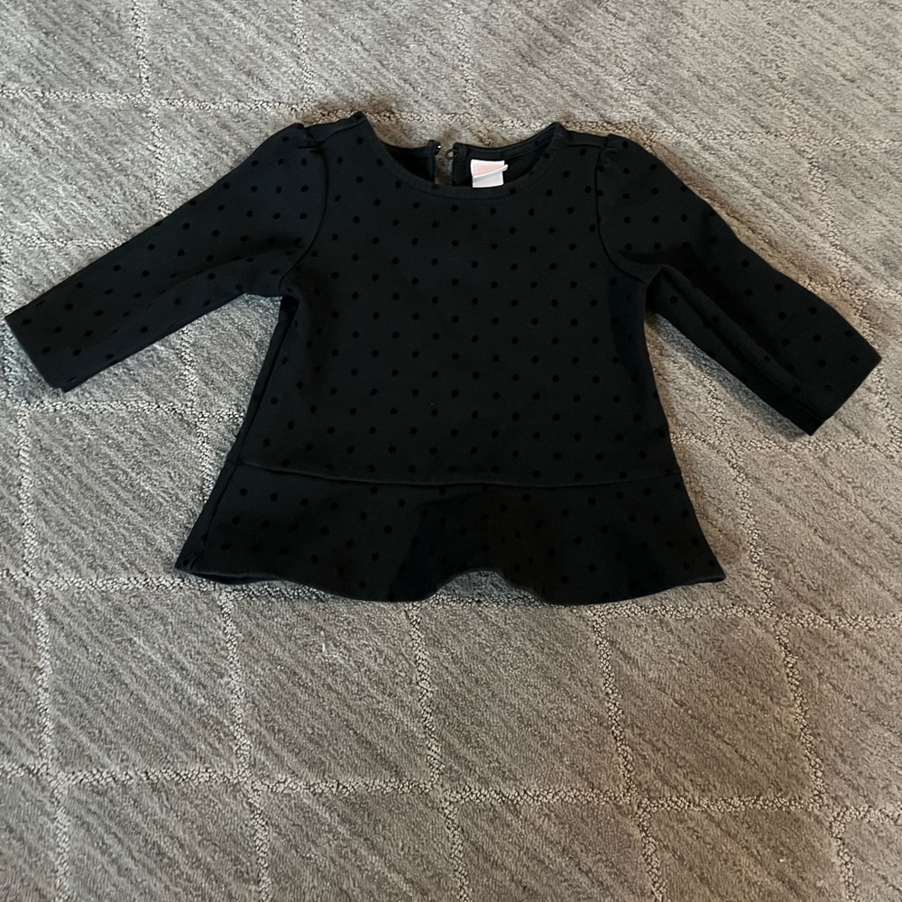 Black peplum style top